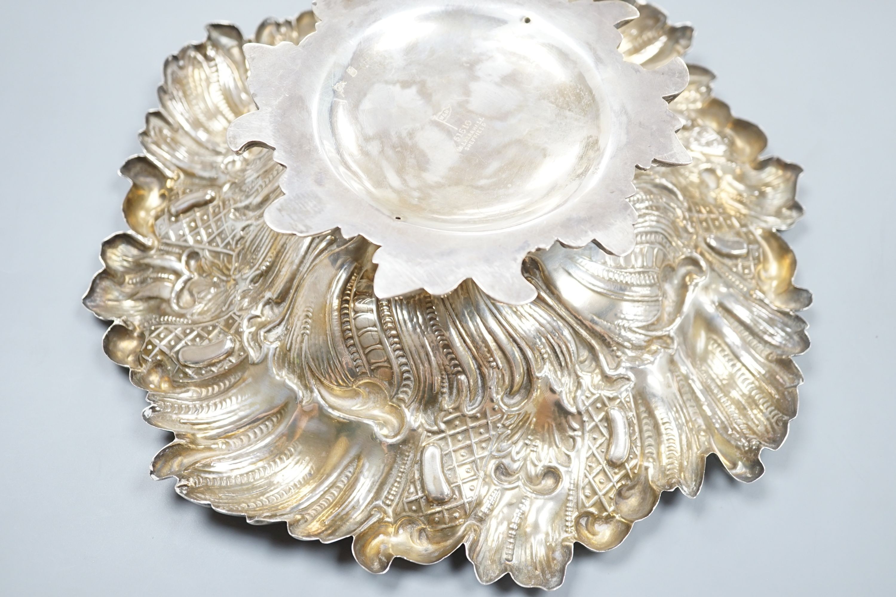 A late Victorian Neo-rococo fruit compote on pedestal stem, all over spiralling rocaille and wave chasing, makers Walker and Hall, Sheffield 1894, 26.75cm diameter, 22oz.